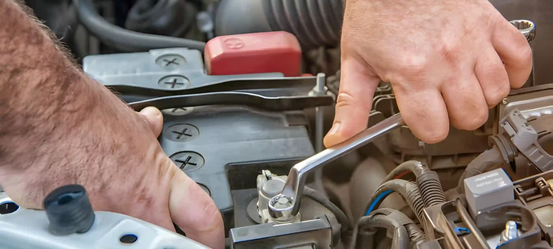 What are the safety precautions when changing a car battery?